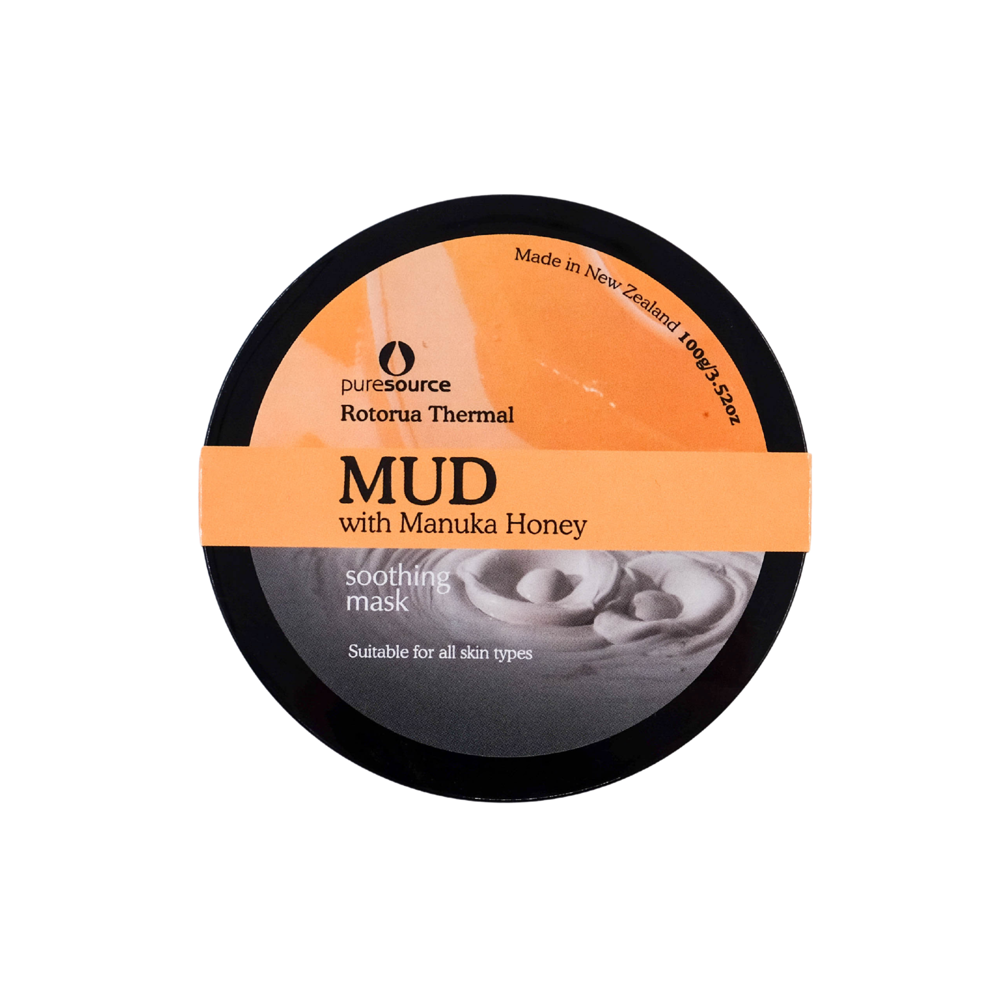Round container of mud with Manuka Honey on a white background
