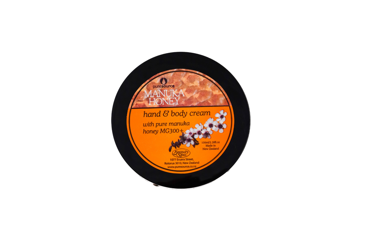 Pure Source New Zealand Manuka Honey Hand and body cream container with orange label on a white background. 